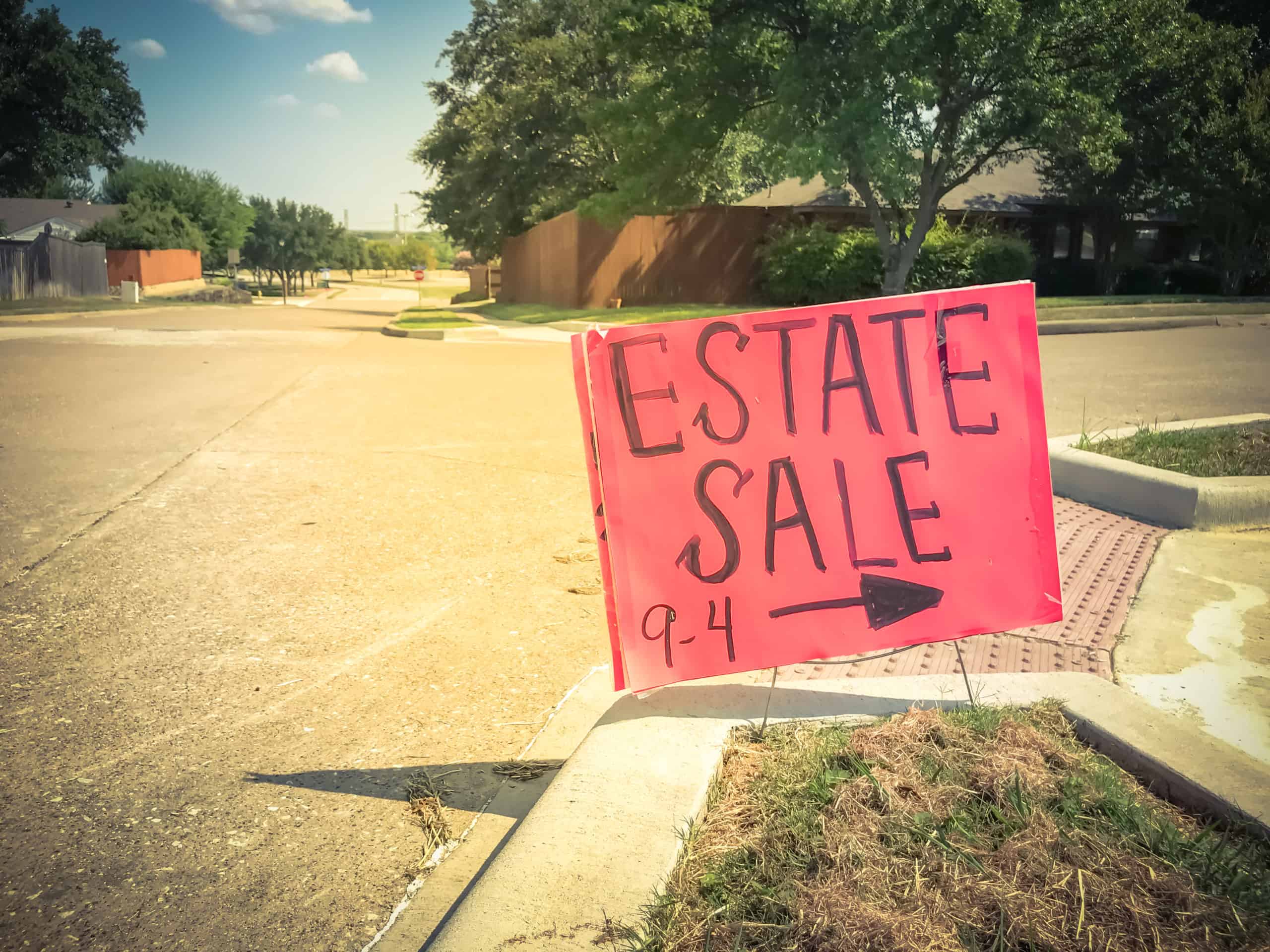 Estate sale sign; an opportunity to purchase items to flip when building wealth.
