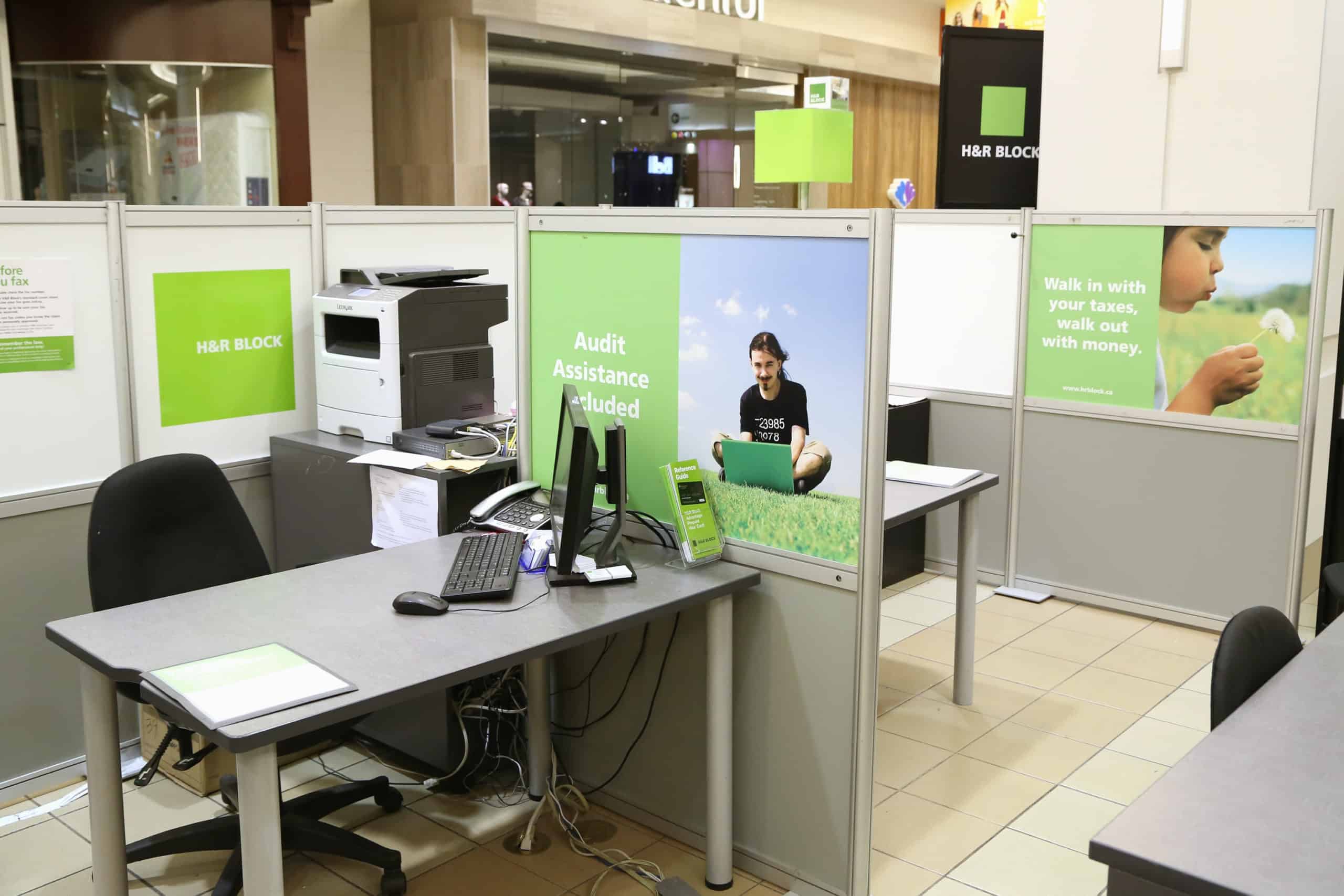 Cubicles of H&R Block tax services.