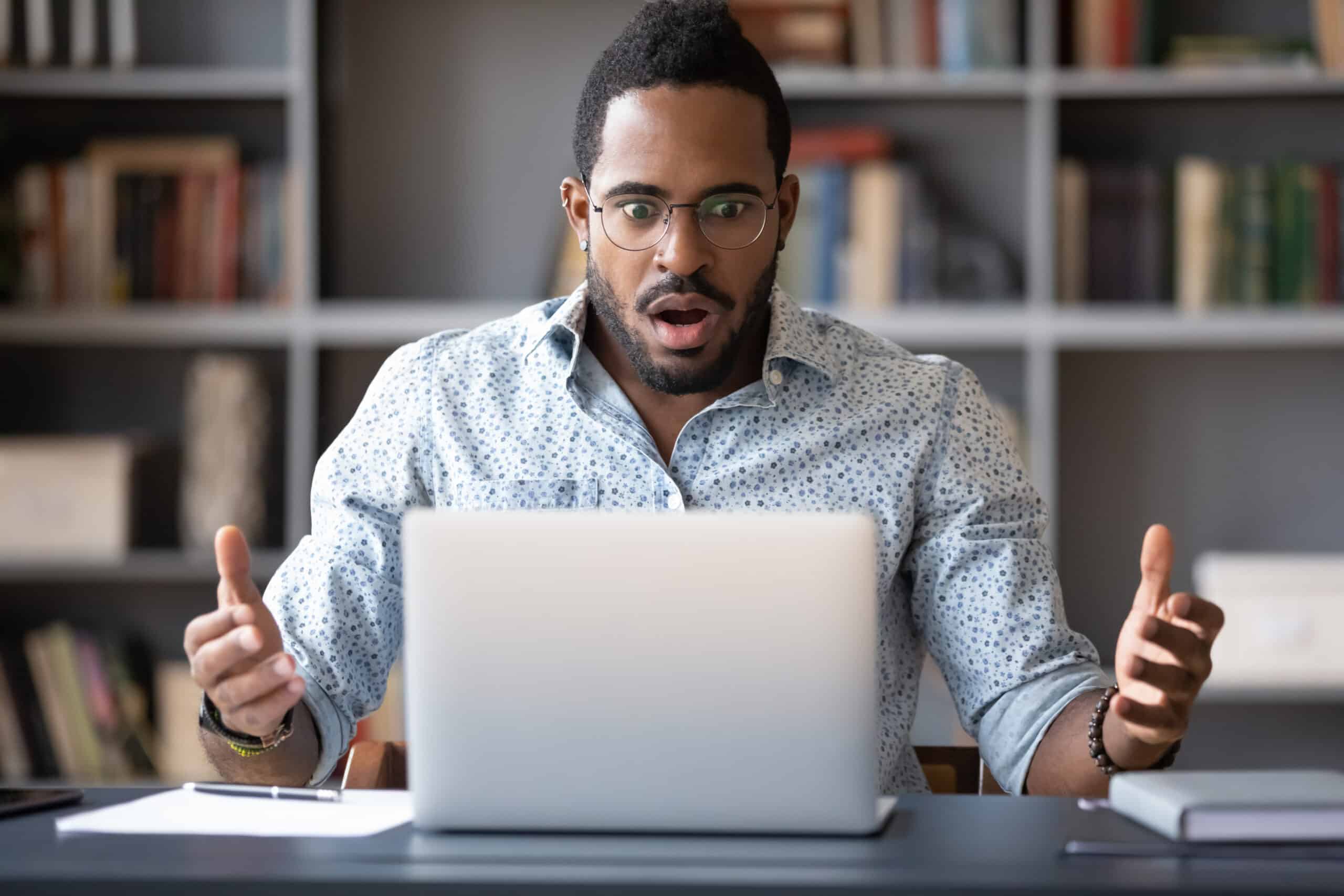 3 Reasons Instacart Grocery Delivery Service Is A Big No-Go For Me 2 Black male surprised trying to figure out Instacart prices for grocery delivery service on a laptop