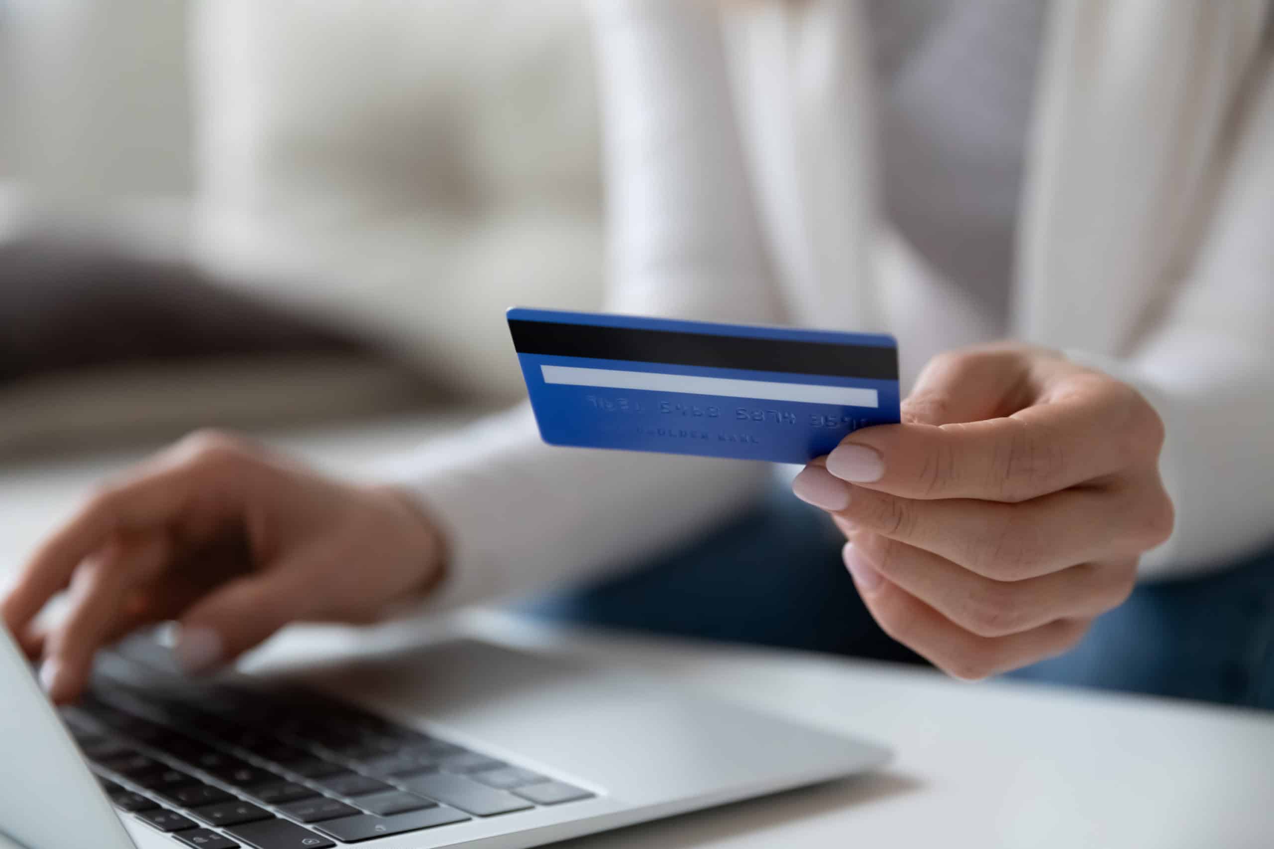 Woman entering credit card information to do a balance transfer