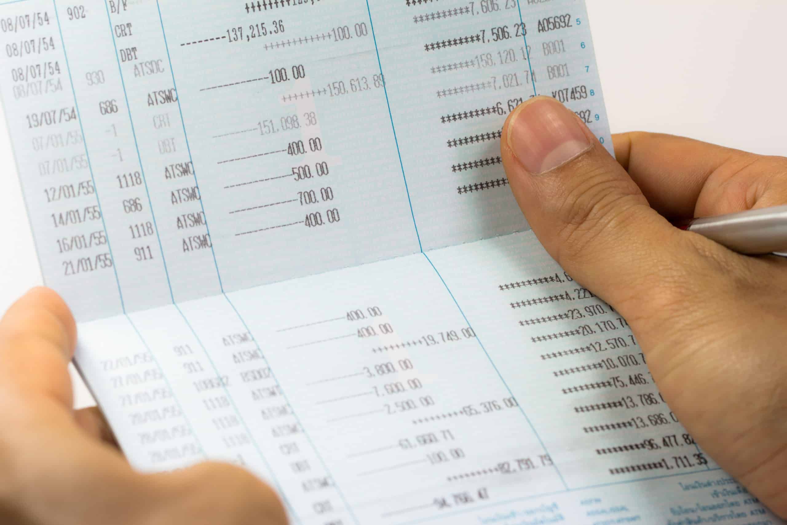 Savings account passbook tracking saving money and interest.
