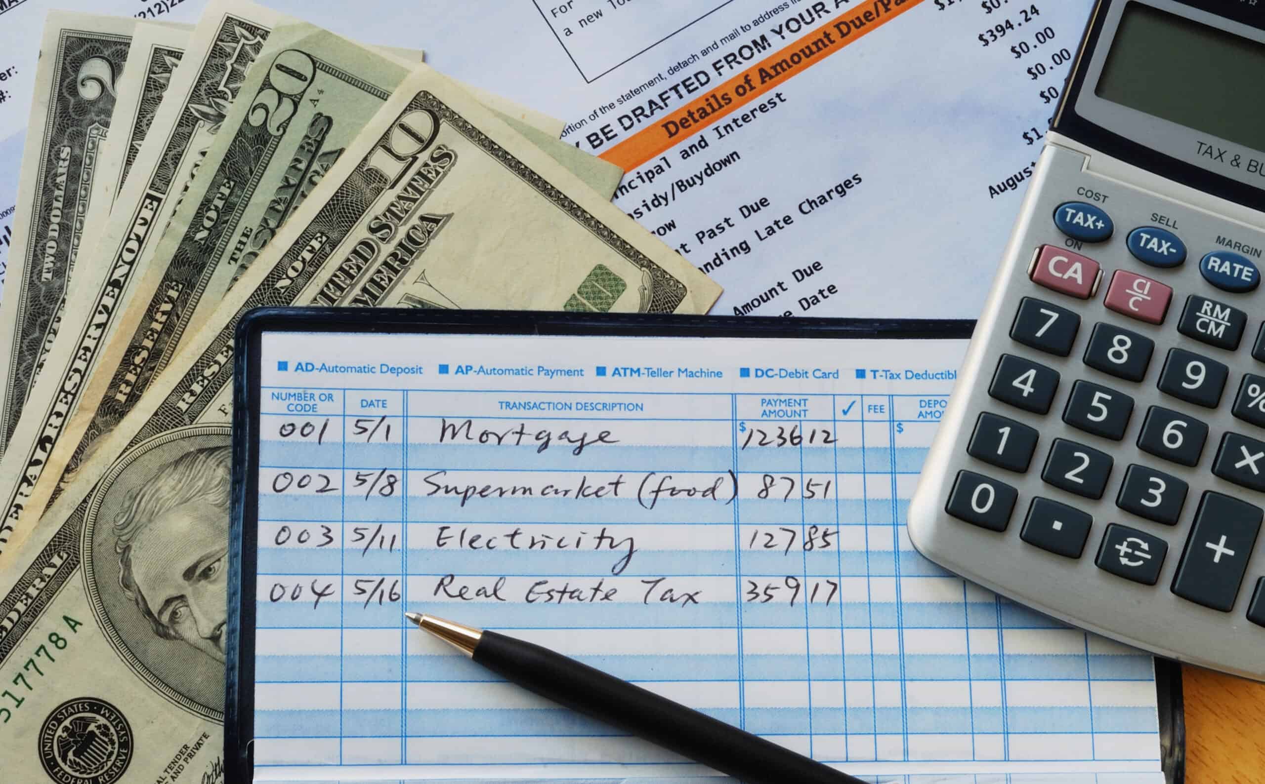 What Is Mortgage Escrow & How Does It Work? 1 Check register with monthly bills like real estate taxes and mortgage entered.