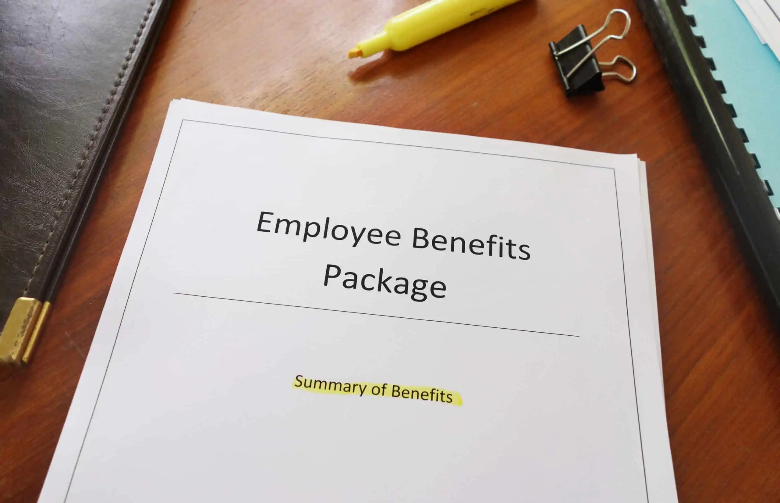 Employee benefits package handbook containing payroll deductions and paycheck calculation information