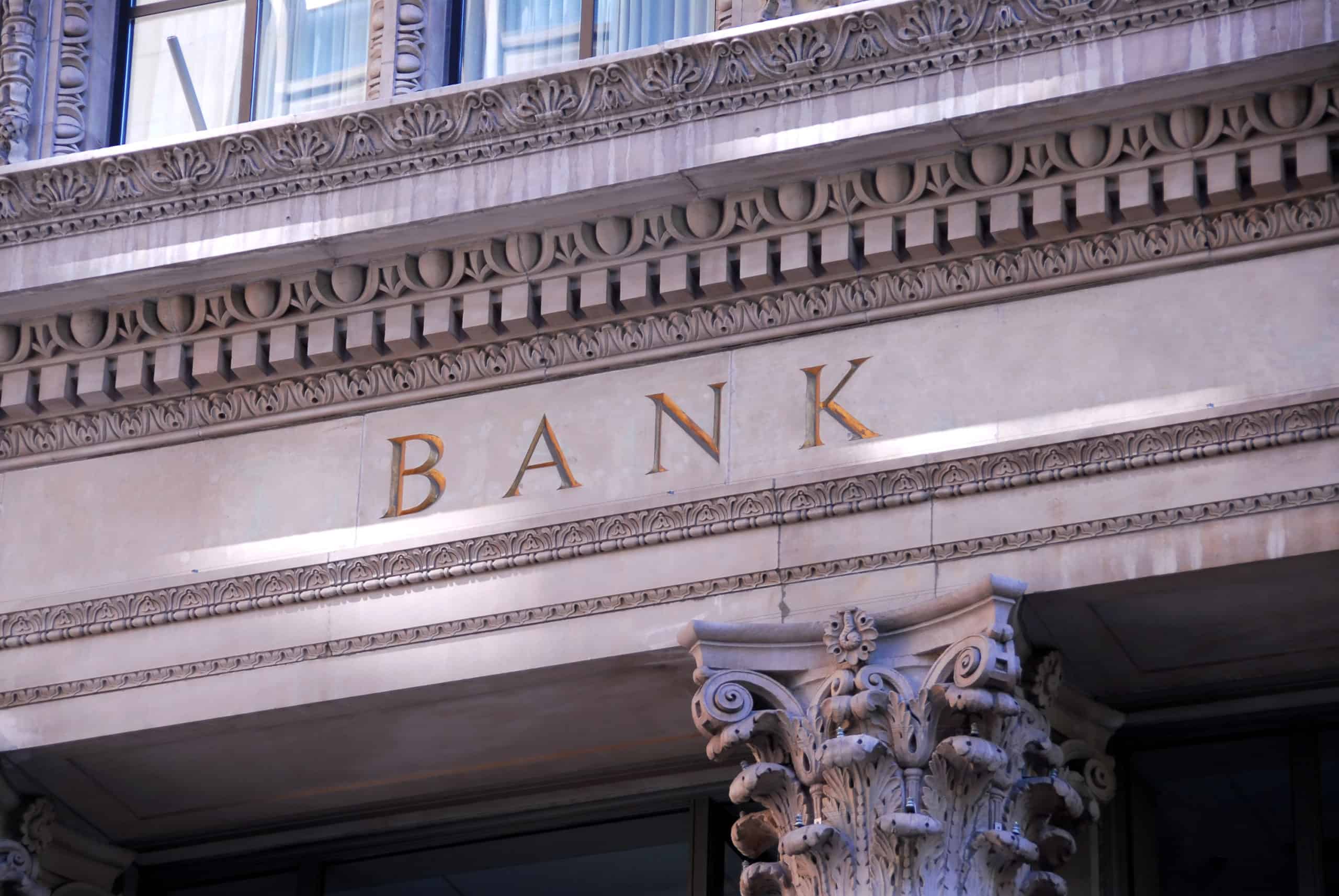 Is Switching Banks Worth The Time & Energy Required? 3 Facing of old bank carved in limestone