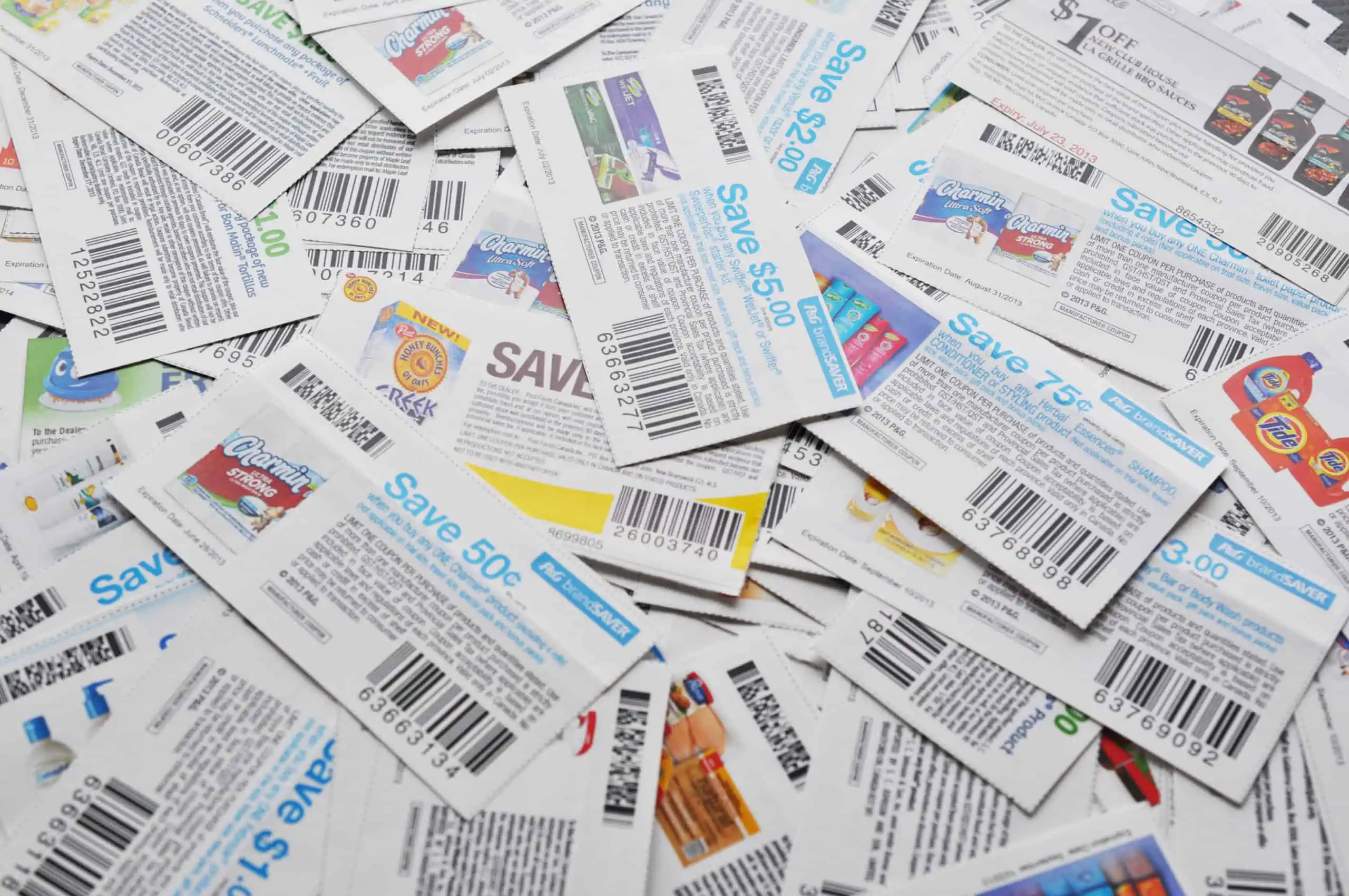 Hundreds of manufacturer coupons piled on top of one another